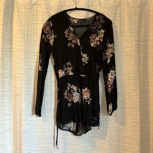 Black long sleeve romper with flower pattern